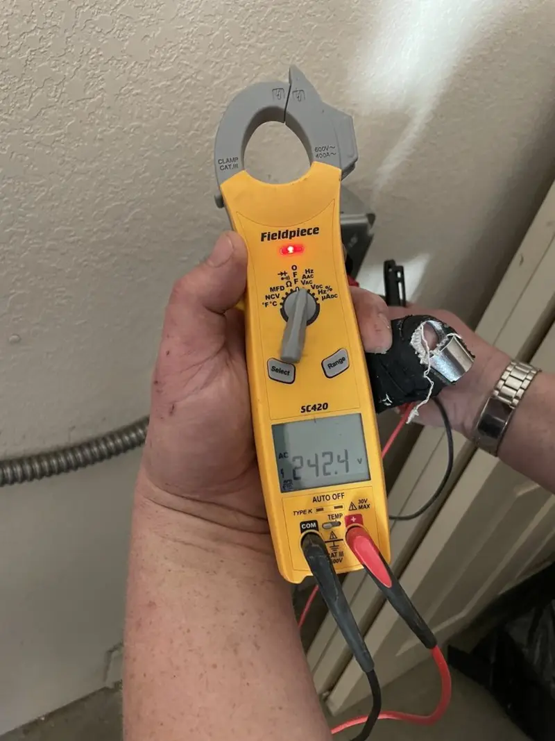 Voltage testing with clamp meter during Ceiling Fan Installation in New Hartford